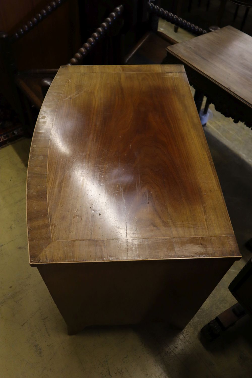 A 19th century banded and inlaid mahogany bow-fronted chest fitted four graduated long drawers, width 86cm depth 56cm height 76cm